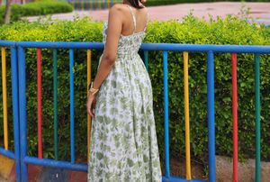 "Backless. Bold. Beautiful. This floral dress is s