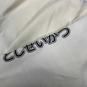 Cream Cropped Sweatshirt.