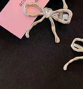 Metal transparent heart crystal bow hair clip