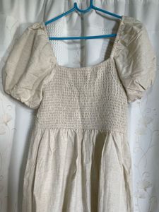 puff-sleeve cream midi dress