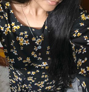 Black dress with yellow n white flowers