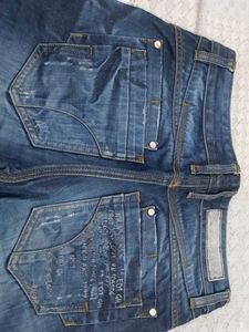 Distressed Blue Denim Jeans