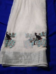 A Beautiful White Saree With Picococks Design