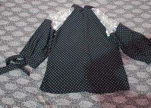 A Black Polyster Top With White Dots Nd Classic .