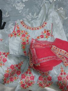 A beautiful grey lehenga with pink detailing