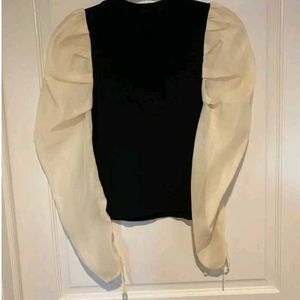 Zara size small black top with cream puffy sleeves