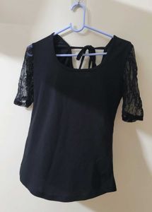 Black Top With Sheer Sleeves And Back Knot