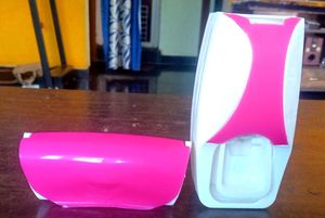 Toothpaste dispenser with toothbrush holder