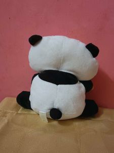 Tarepanda plush toy playing a flute