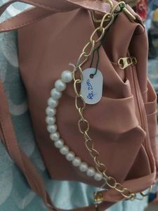 Stylish Pink Handbag with Chain Detail