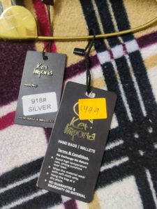 Silver Clutch with Safety Pin Detail