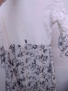 a fancy floral white dress