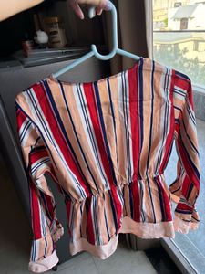 A beautiful peplum top with strips