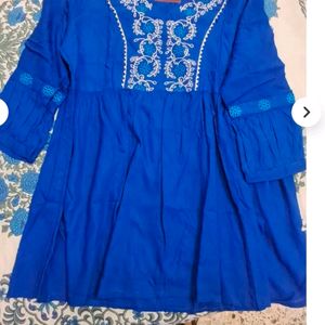 The Size Is XXI This Vibrant Colour Short Kurti .