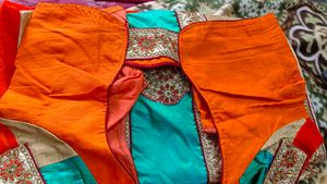 Orange Saree With Turquoise And GoldenBorder