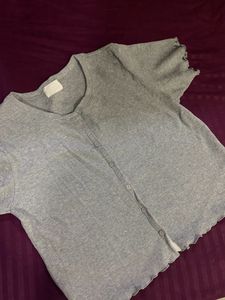 grey button top