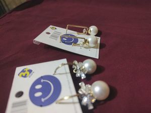 2 pair of gold plated pearl earrings with a stone