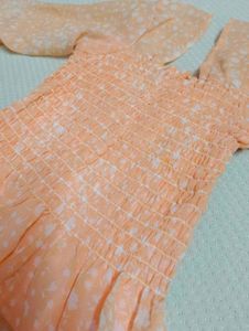 Peach Smocked Peplum Top