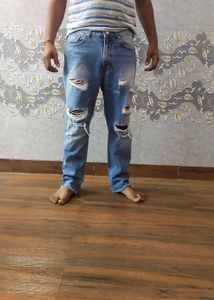 Ripped Blue Denim Jeans