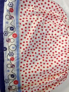A Beautiful White Frok With Red Polka Dots