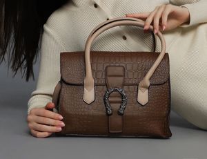 brown medium handbag 👜