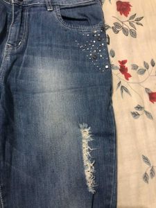 Slim Fit Distressed Denim.