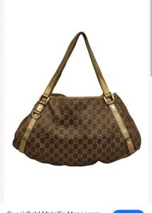 Gucci Gold Metallic Monogram Abbey Dring Toet