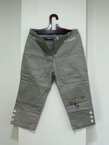 Brand new Capri Pants with Floral Detail