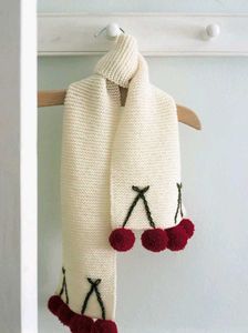 Charming Knitted Scarf with Pom-Poms