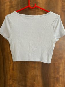 Fitted crop top with button front and scoop neck