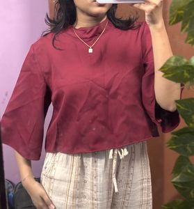 maroon high-neck flowy top