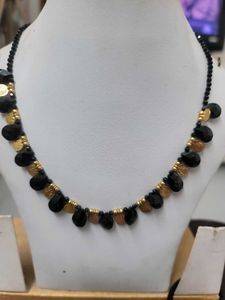Black Beads With Gold Bead