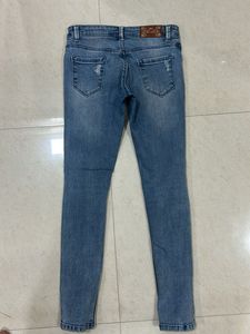 Distressed Denim Skinny Jeans