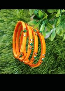 Orange Bangles with Green and White Stones