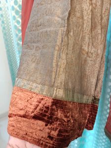 Heavy Designer Party Wear Golden Silk Printed Kurti With Churidar Net Sleeves , Full Lining And Velvet Border . Heavy Zardozi Embroidery On Front . Shaded Chiffon Dupatta With Gota. No Bottom.