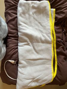 Set Of Cloths In Bag With Electronic Bed Heater