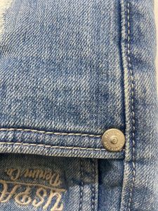 Light blue denim jeans with a cool distressed look