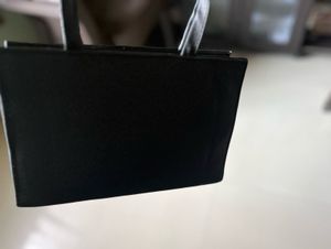 Chic Black Handbag with Logo Detail