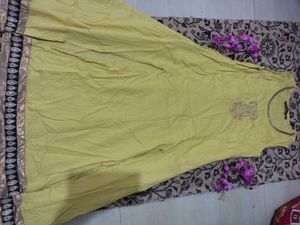 Yellow Sleeveless Dress with Embellished Hem