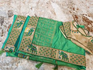 Elegant Green Silk Saree with Elephant Border