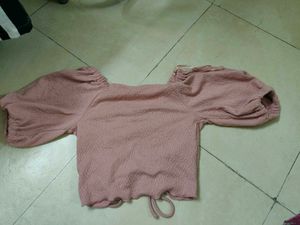 A Pink Crop Top With Pullup Strings In The Size M