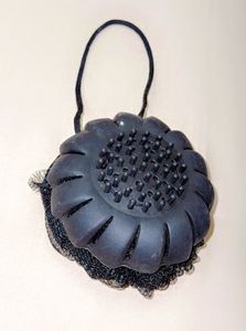 A two-sided bath puff Or Loofah