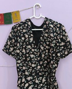 a black floral tie up dress