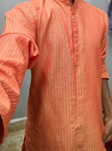 Orange Kurta With Silk Work On It.