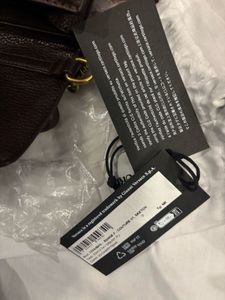 Versace Couture sling bag