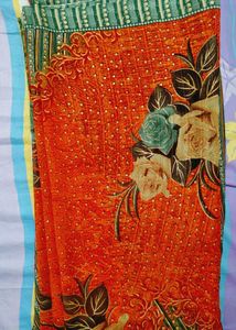 Elegant Orange Printed Saree with Floral and Geome