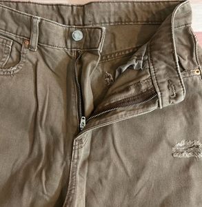 faded brown rugged jeans