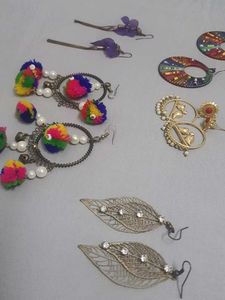 Multiple Pairs Of Earings And One Necklace
