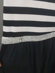 Only wore it a few times. Can wear as long gown or midi