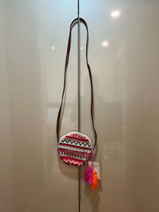 Astrid round Geometric print sling bag for women